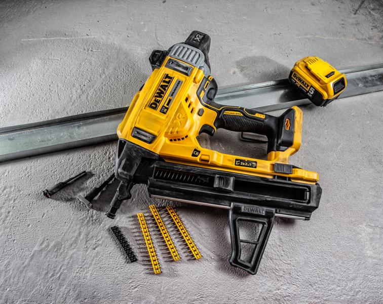 A DEWALT DCN890P2 cordless nail gun is shown on a concrete surface, alongside a battery pack, metal strip, nail cartridges